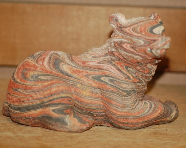 Kickingbird Laying Bear Statue